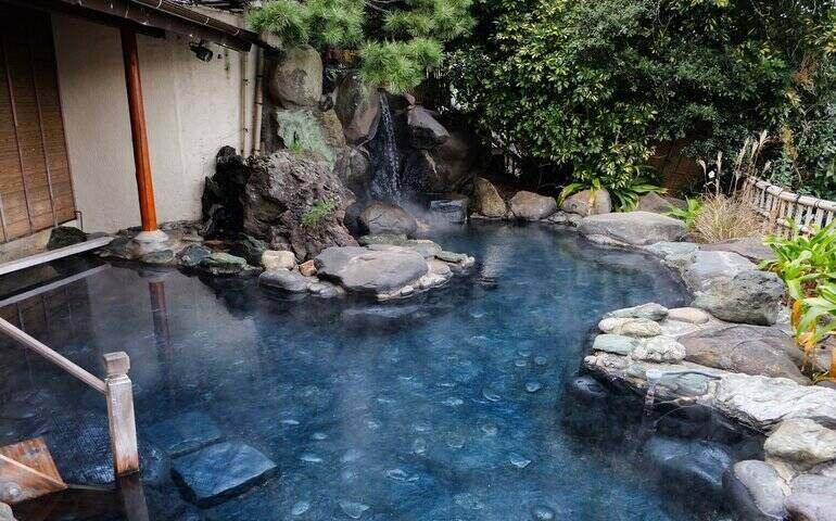 Relaxing open air hot bath onsen overlooking the city of Ito, Shizuoka, Japan