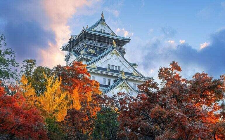 Osaka Castle with beautiful foliage in autumn in Osaka, Japan