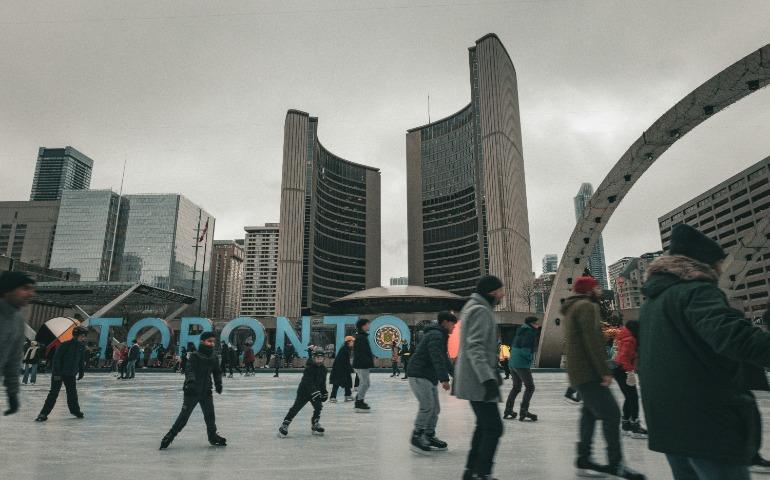 People Ice skating in front of a giant sign of Toronto 
Image Credit: Jonathan Gong/Unsplash