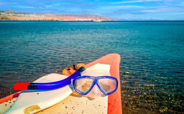 A snorkel set on a kayak boat, at a Red Sea beach, Saudi Arabia