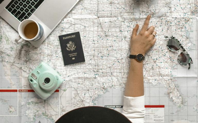 Person Pointing a Location on the Map
