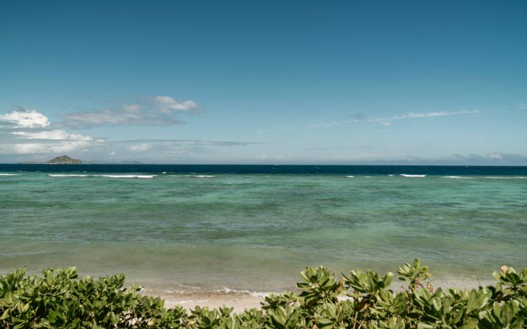 View from island out to the ocean and small island  