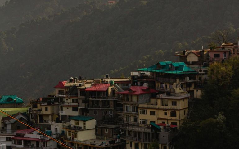 A view of a city with mountains in the background