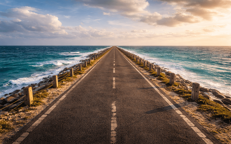 A dramatic road shot with water on both sides.