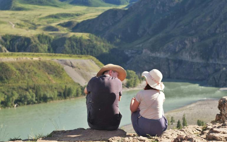Travelling couple is watching the landscape