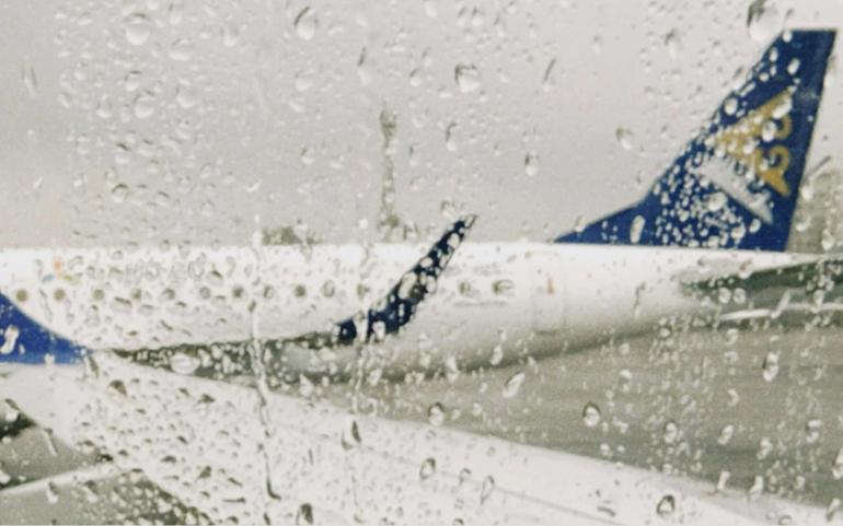 Rainy View of Airplane Window 