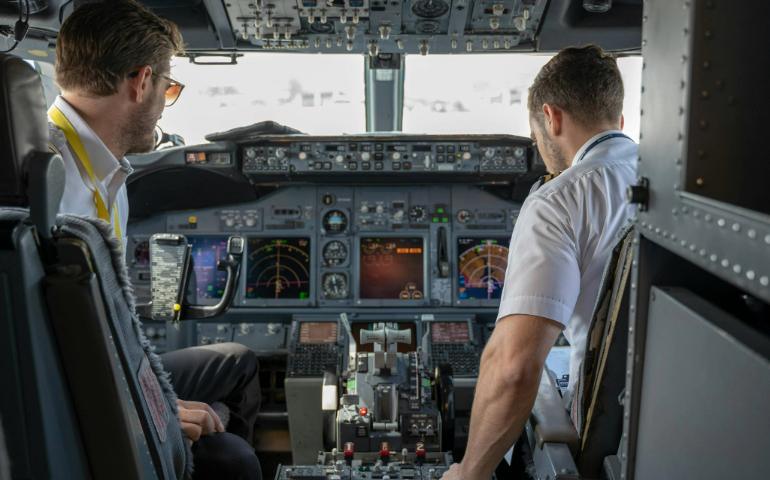 Two Pilots Sitting Inside Plane