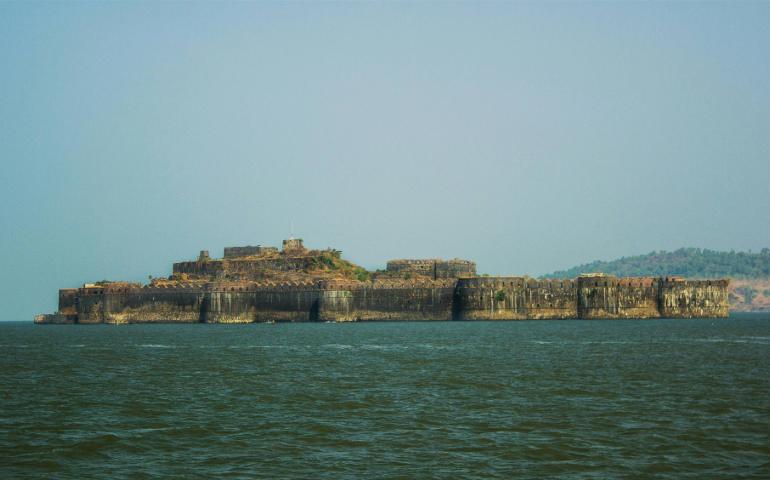 Brown Concrete Building on the Ocean
