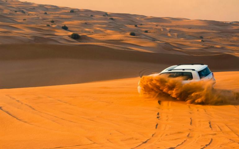 White SUV in Dubai Dessert