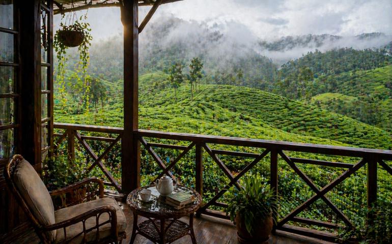 A cozy balcony overlooking endless tea gardens.