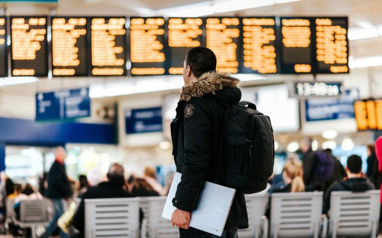 A Man Standing Inside the Airport