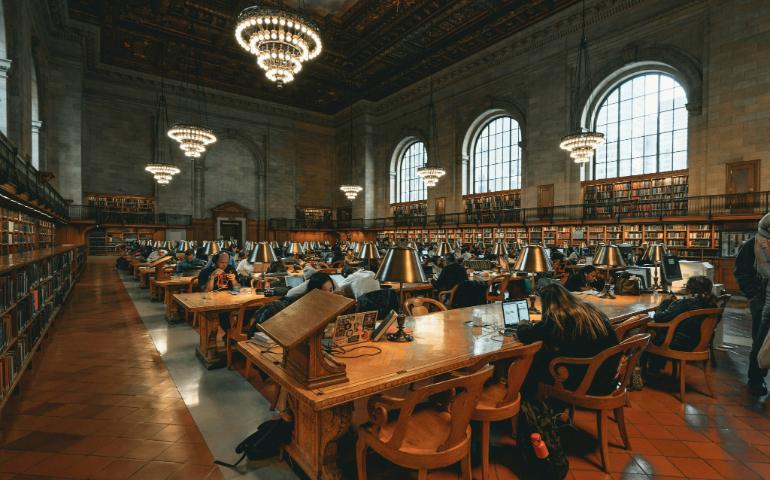 People studying in the New York Public Library 
