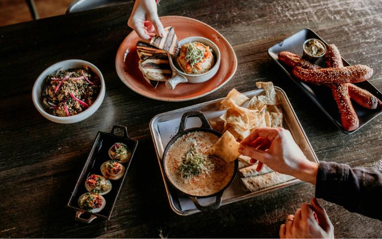 People eating a variety of food
