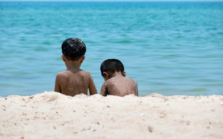 Kids chilling by the sea