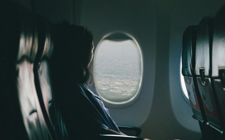 Woman by an Airplane Window  