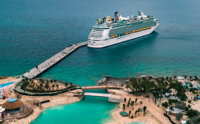 Aerial view of people boarding a cruise ship

