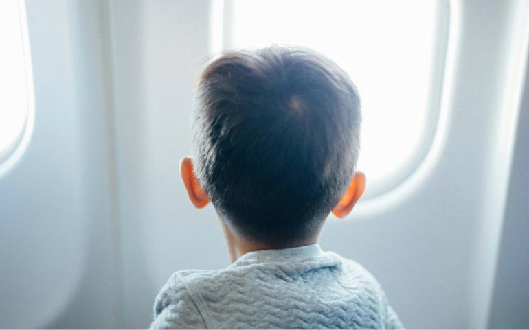 Curious Kid Looking out of the Window