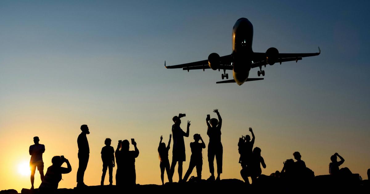 People photographing an airplane during a vibrant sunset
Alexander Grigorian/Pexels