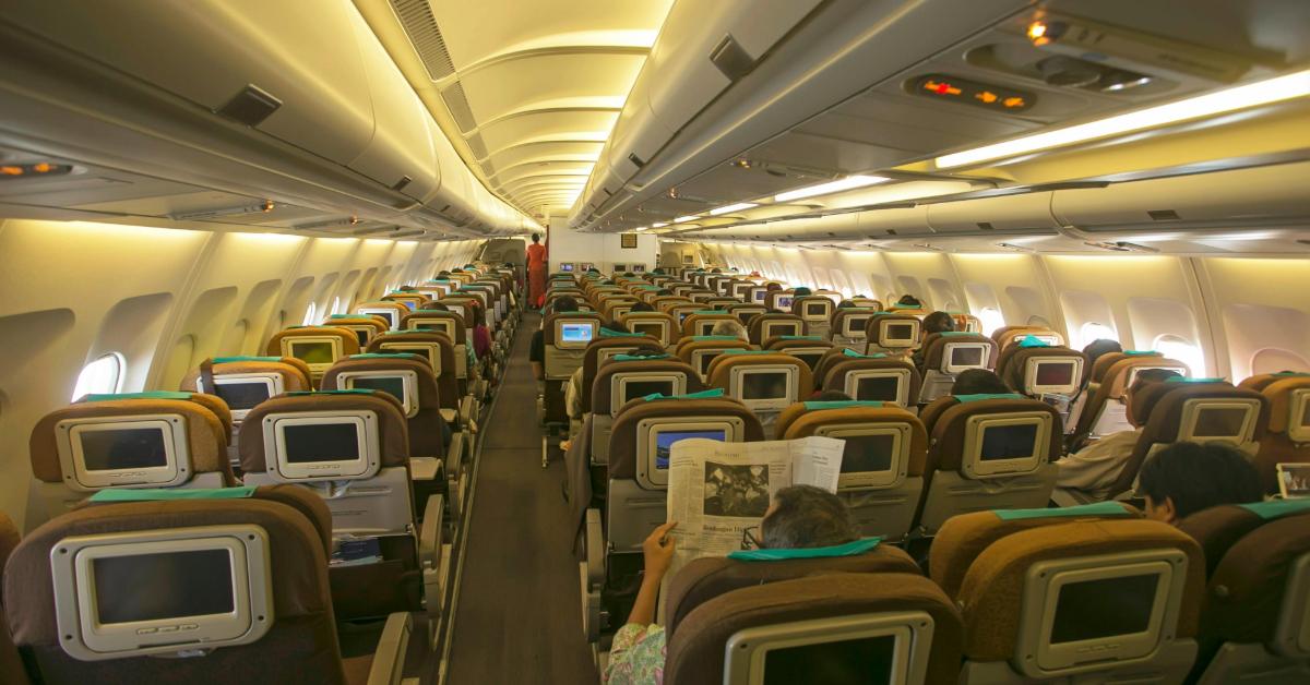 View of an airplane's cabin interior with passengers seated
Jeffry Surianto/Pexels