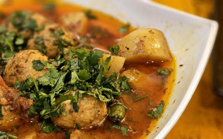 Flavorful Indian Aloo Kofta Curry Garnished with Fresh Coriander