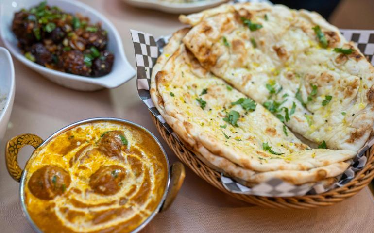 Indian Cuisine Featuring Curry, Naan Bread, and Flavorful Dishes