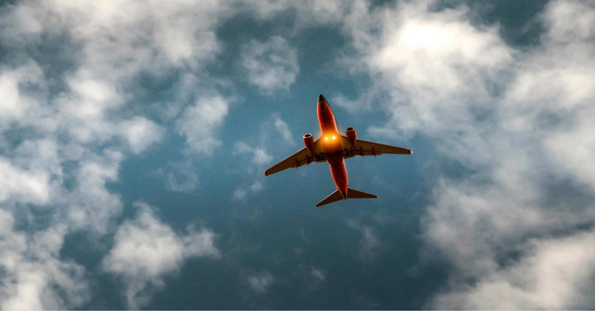 Captivating low-angle view of an airplane flying against a cloudy sky, ideal for travel themes.
Quintin Gellar/Pexels