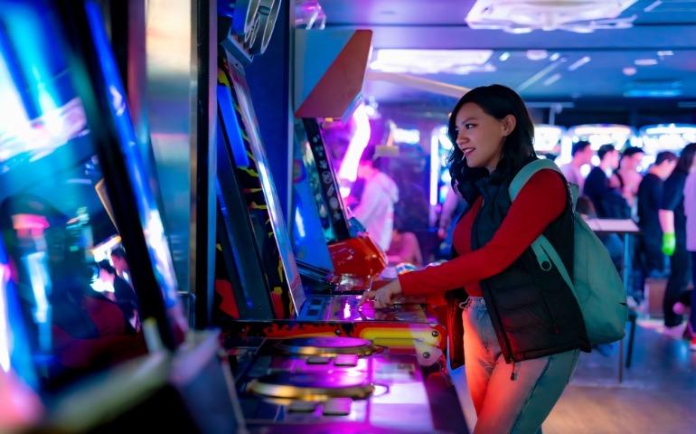 A tourist playing arcade games in Akihabara, Tokyo