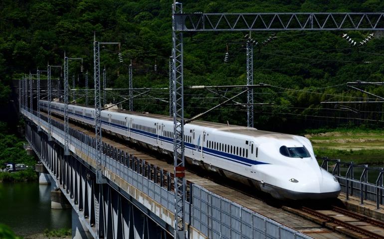  An N700 series Shinkansen train traveling on the Sanyo Shinkansen Takahashi River Bridge, Japan