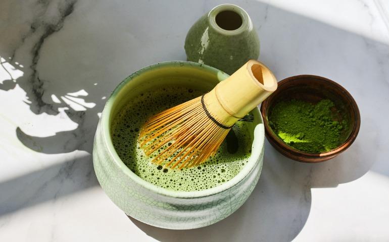 Matcha Tea Preparation. Ceremonial matcha bowl with whisk and matcha powder