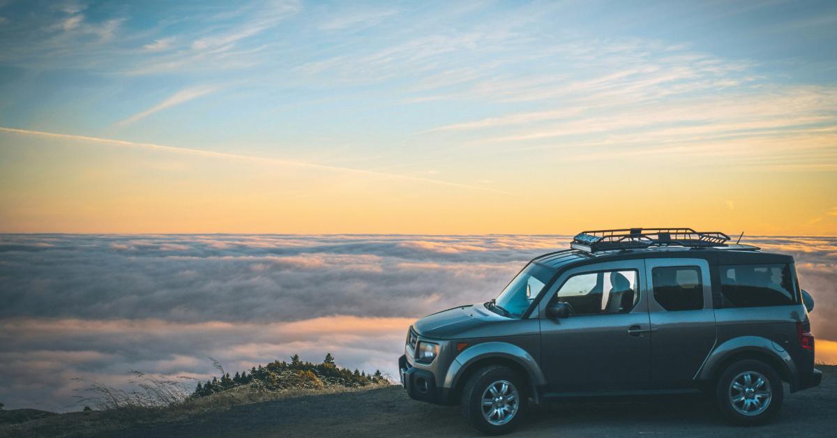 Car standing on a scenic road