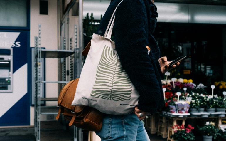Person carrying a cotton bag