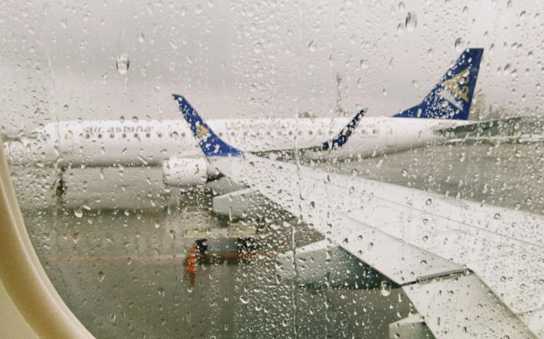 Raindrops on plane window
