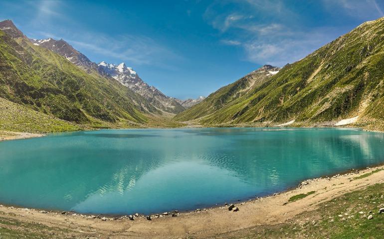 Blue Lake Near Mountains under the Sky
