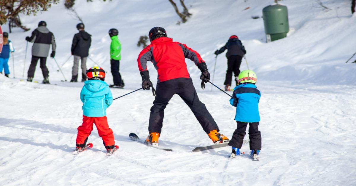 A Perfect Family Day Enjoying Skiing Under Clear Mountain Skies
