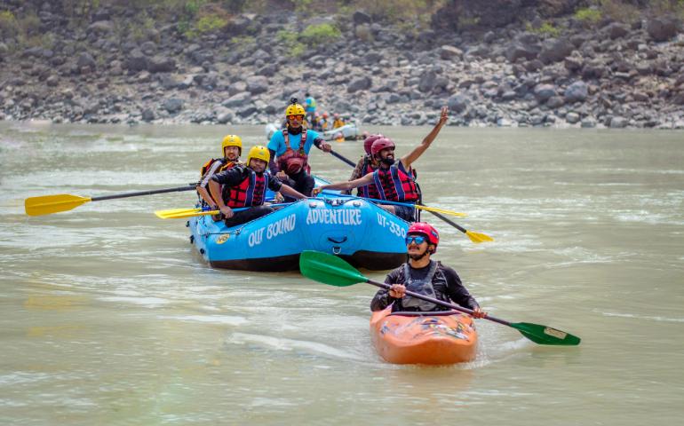 Group enjoying rafting and kayaking on the Ganges in Rishikesh