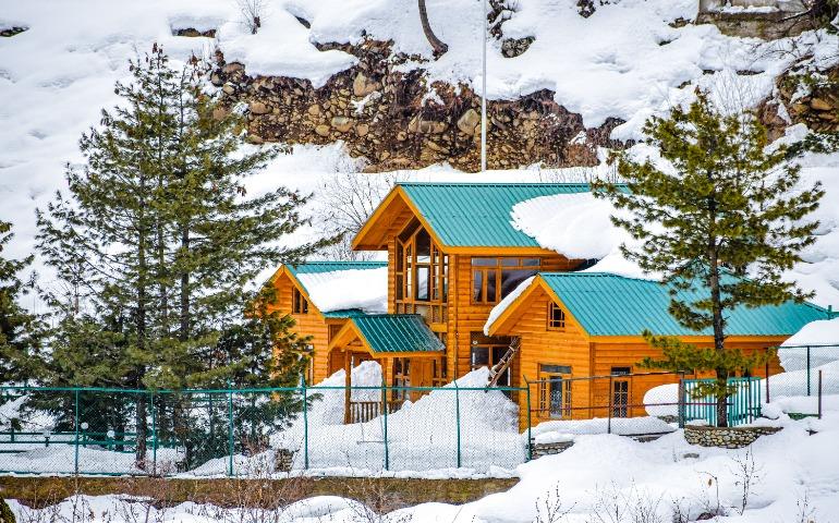 Snow-covered Wooden Chalet in Pahalgam