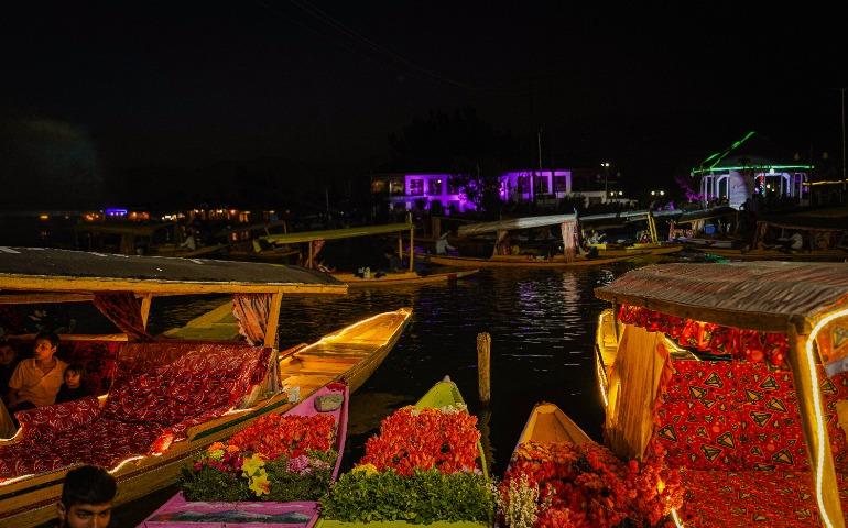 Decorated Boats Illuminating a River During a Traditional Festival