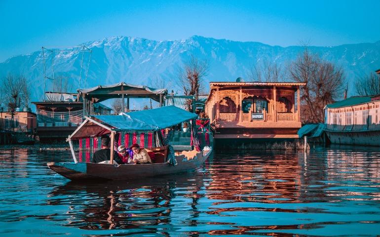 A Group Enjoying a Shikara Ride on Dal Lake, With Stunning Mountain Views in Srinagar, Kashmir