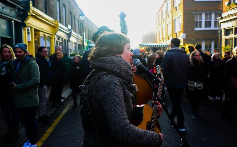 People singing and playing instruments in London