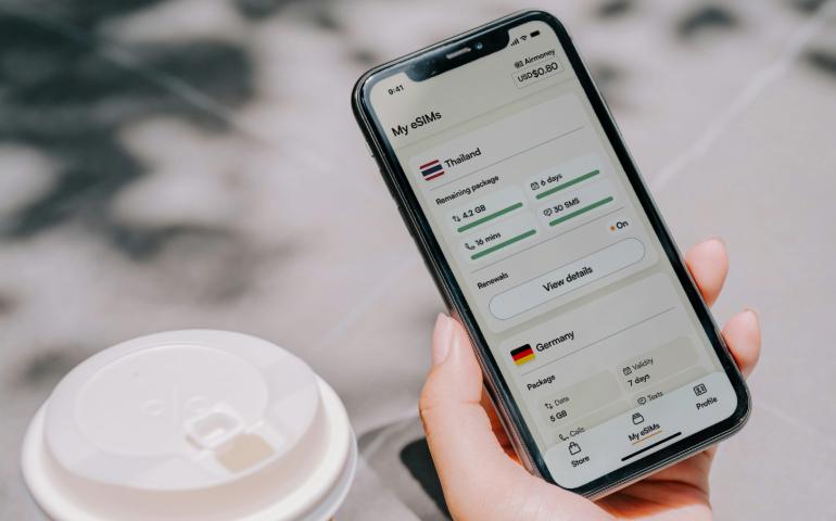 Traveler staying connected with an eSIMs