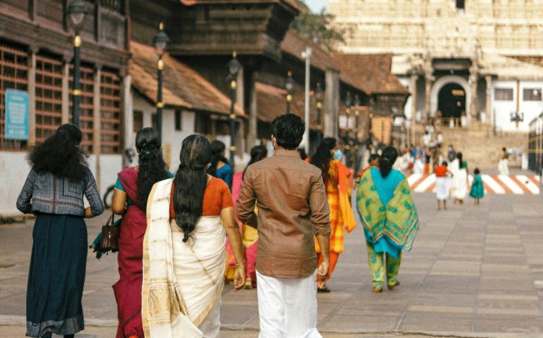 People visiting temple wearing traditional clothes