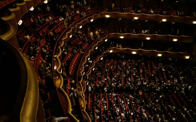 Audience waiting, seated, in a theatre, opera house in New York.