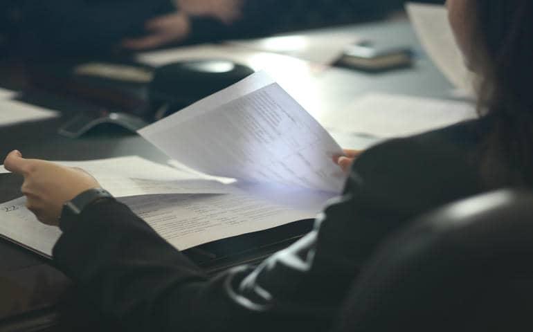 A woman checking documents

