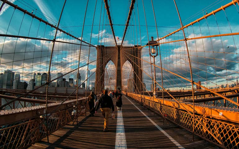People walking on the Brooklyn Bridge