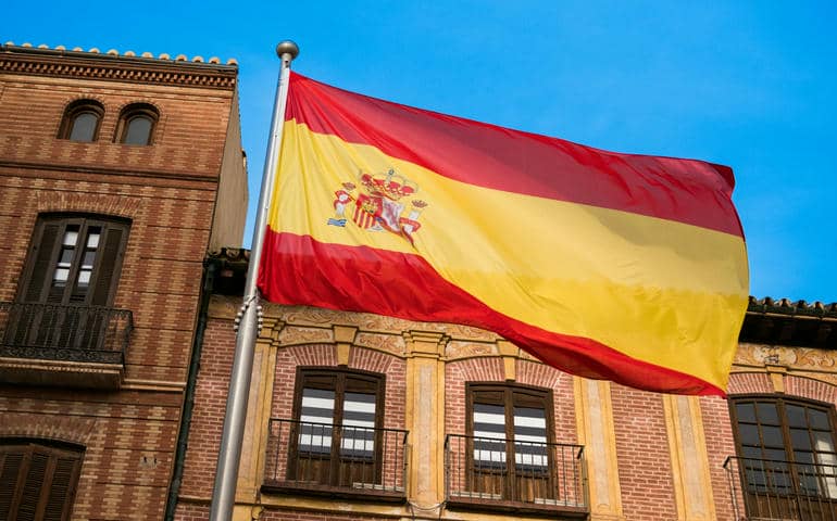 Spanish flag flying in the street.

