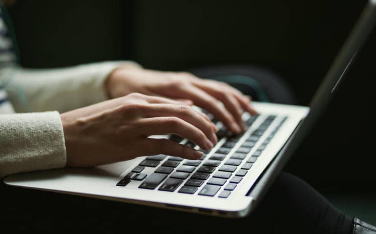 A person using a laptop
