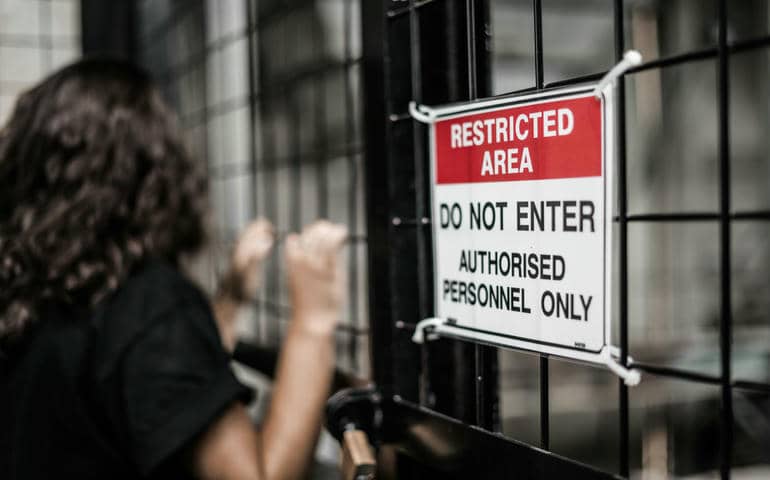 Restricted area sign on a gate
