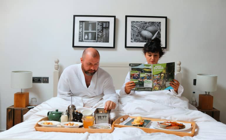 A husband and wife in a hotel room
