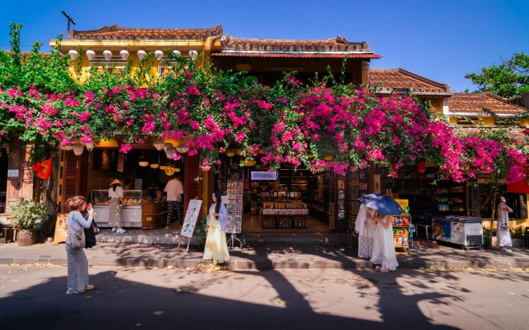 People taking photos on the street in Hoi An
