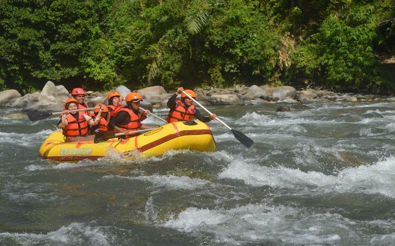 Thrilling white-water rafting experience with a group of adventurous adult.